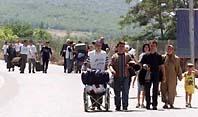 Group of refugees leaving town